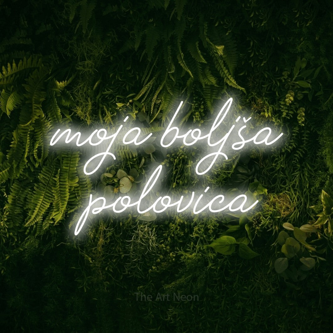LED neon sign reading “moja boljša polovica”, arranged in two lines.