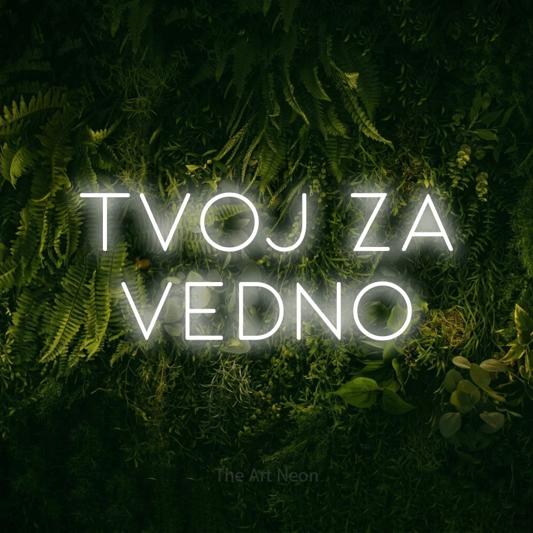 LED neon sign reading “TVOJ ZA VEDNO”, arranged in two lines.