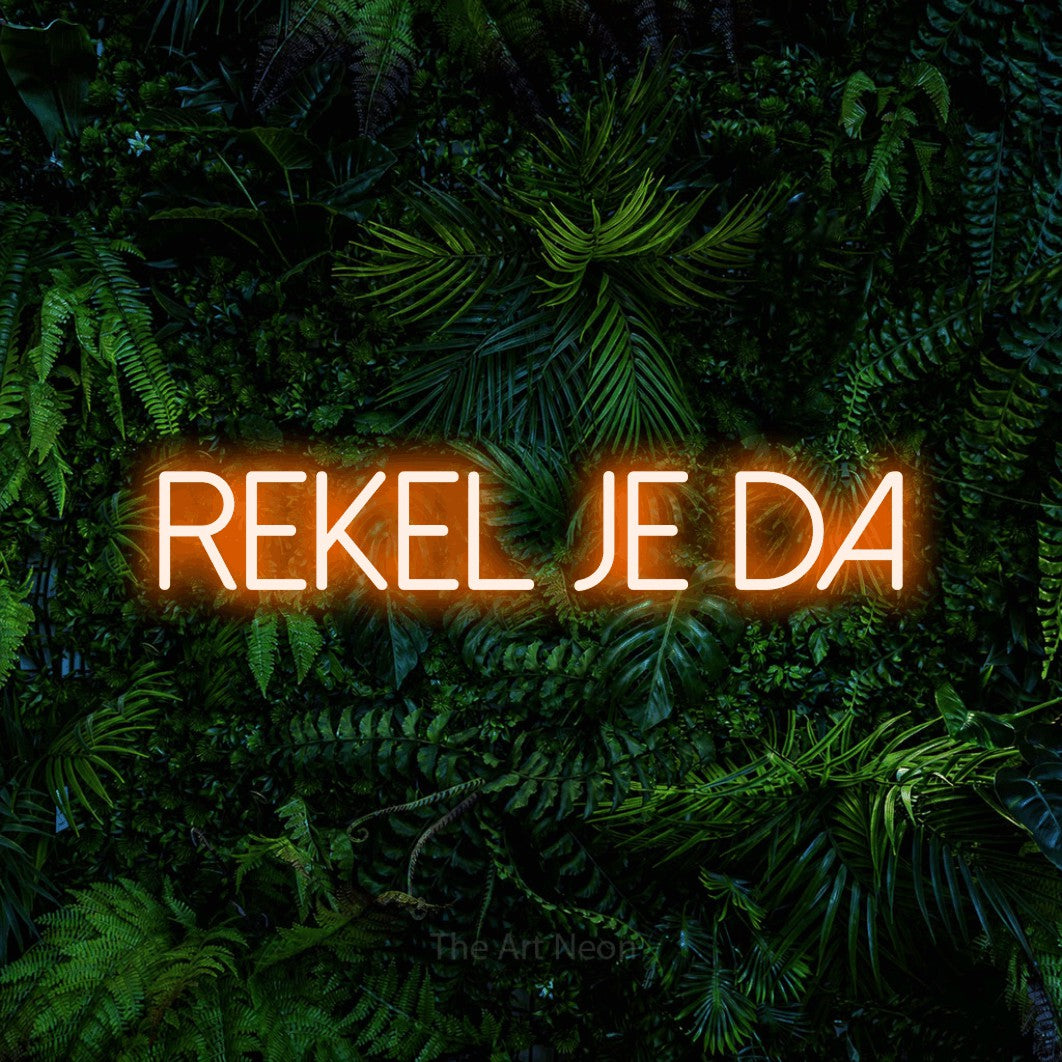 LED neon sign reading “REKEL JE DA”, arranged in a single line.