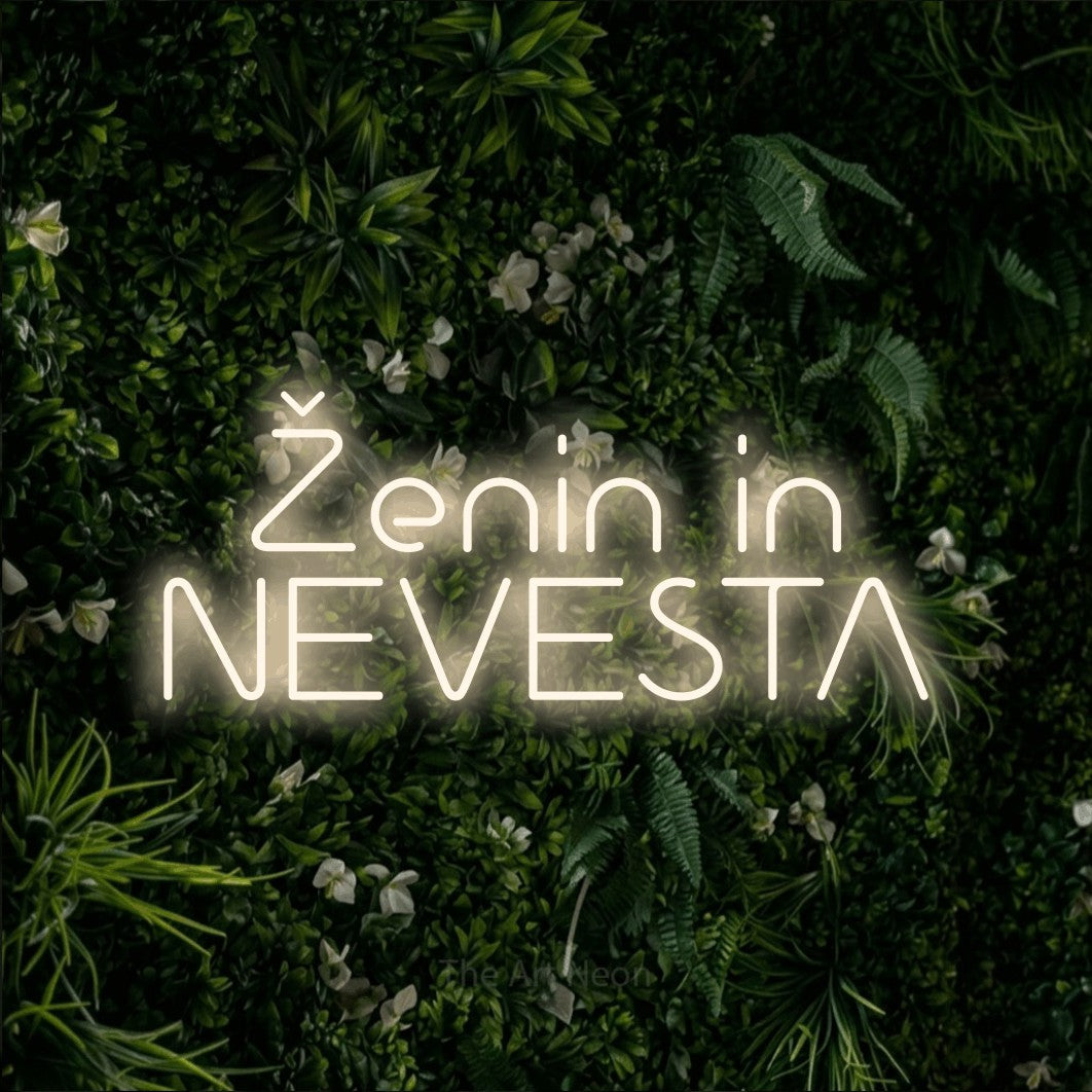 LED neon sign reading “Ženin in NEVESTA”, arranged in two lines.