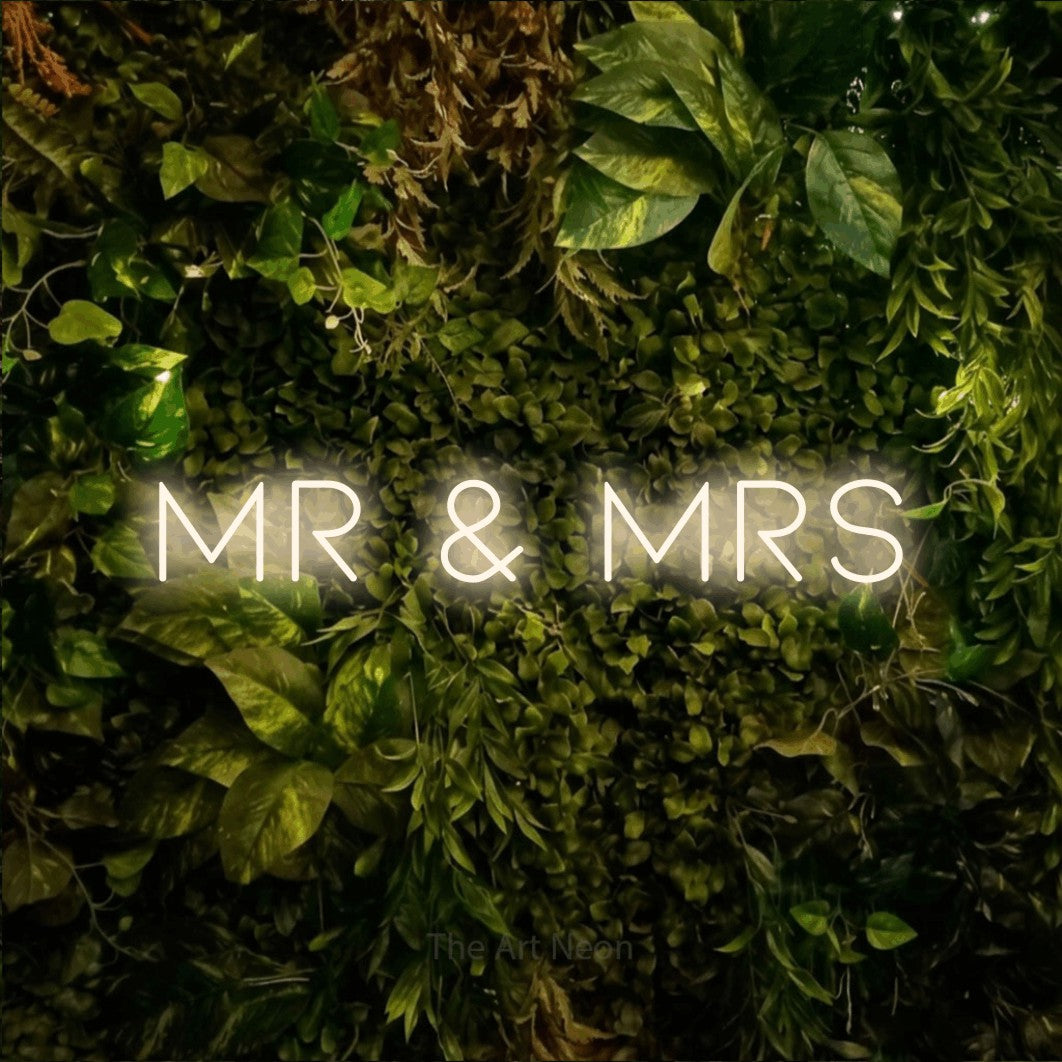 LED neon sign reading “Mr & Mrs”, arranged in a single line.