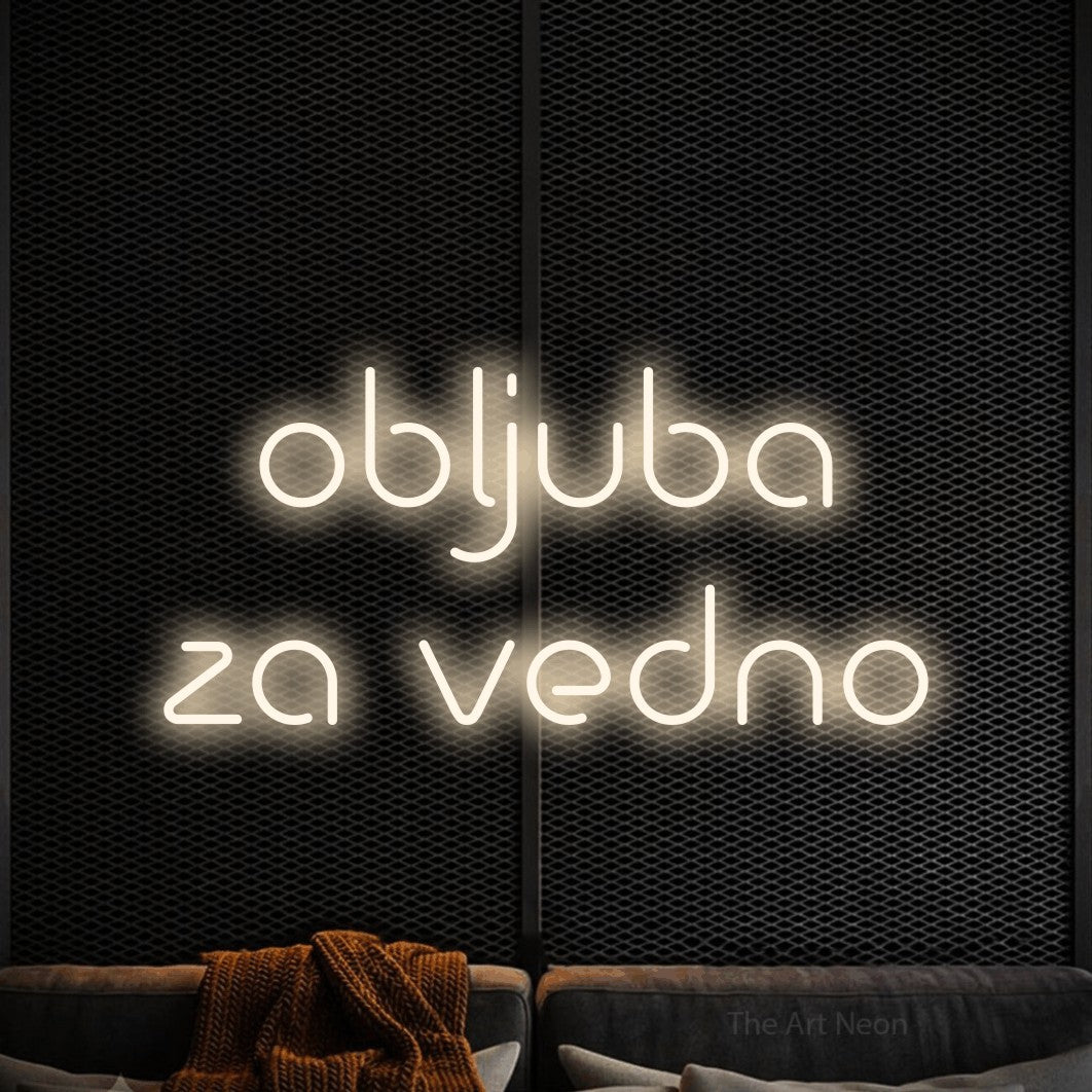 LED neon sign reading “obljuba za vedno”, arranged in two lines.