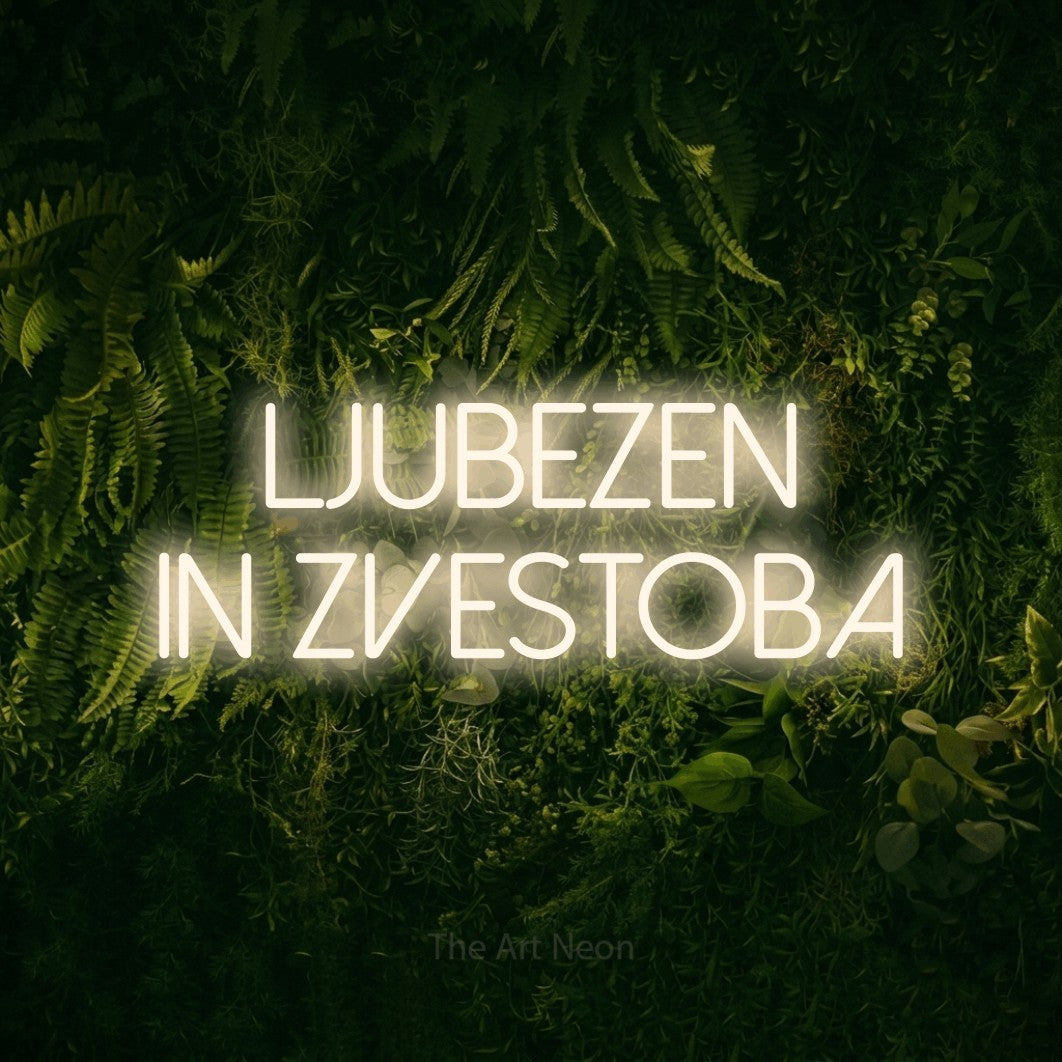 LED neon sign reading “LJUBEZEN IN ZVESTOBA”, arranged in two lines.