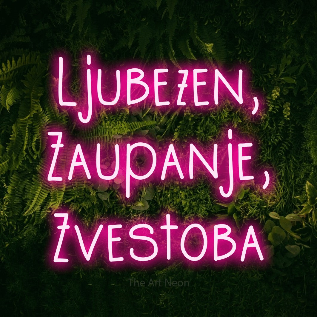LED neon sign reading “Ljubezen, Zaupanje, Zvestoba”, arranged in three lines.