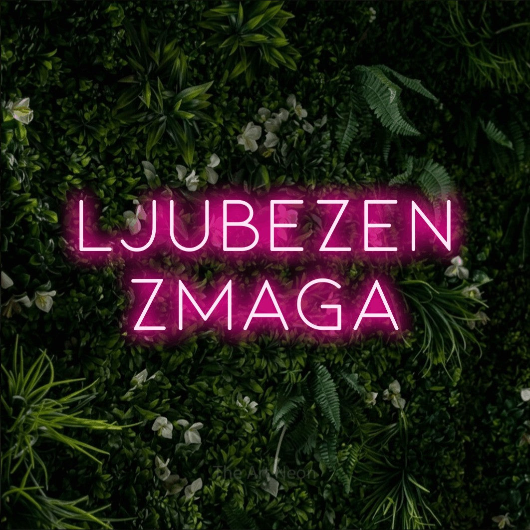 LED neon sign reading “Ljubezen Zmaga”, arranged in two lines.