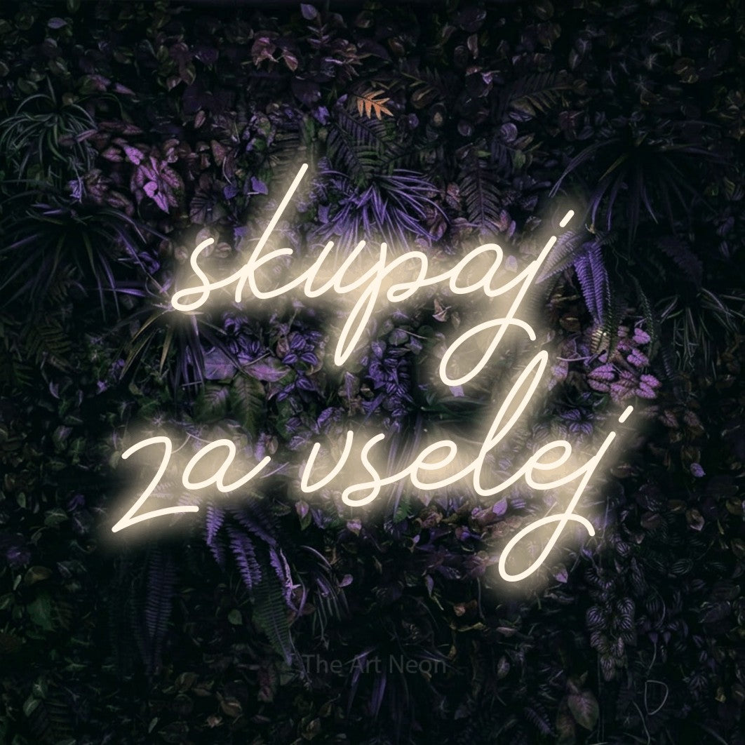 LED neon sign reading “skupaj za vselej”, arranged in two lines.