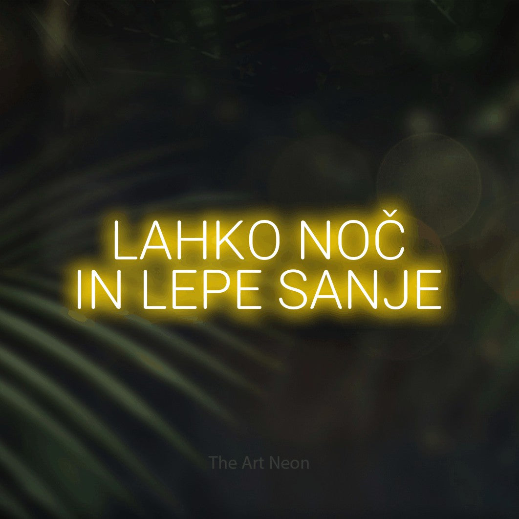 LED neon sign reading “LAHKO NOČ IN LEPE SANJE”, arranged in two lines.