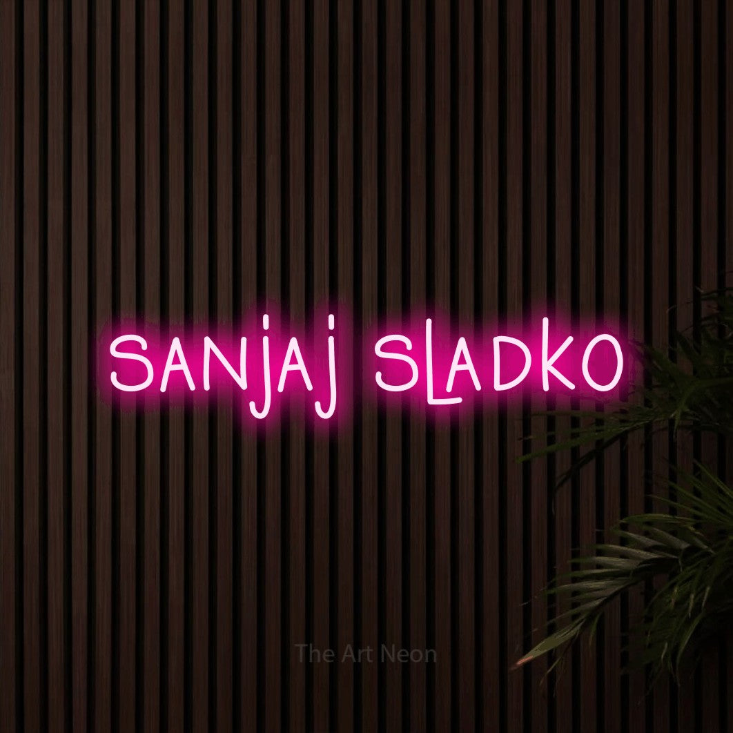 LED neon sign reading “sanjaj sladko”, arranged in a single line.