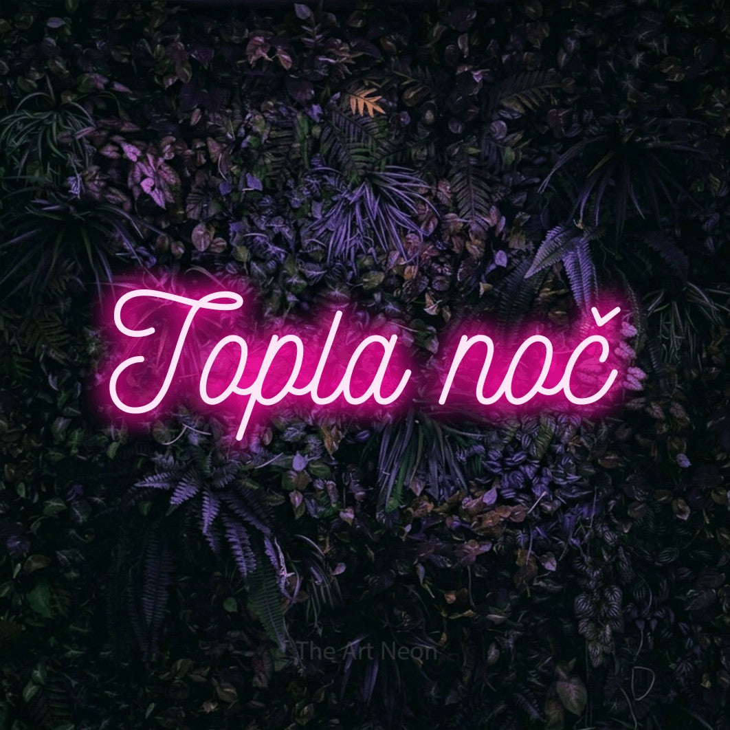 LED neon sign reading “Topla noč”, arranged in a single line.