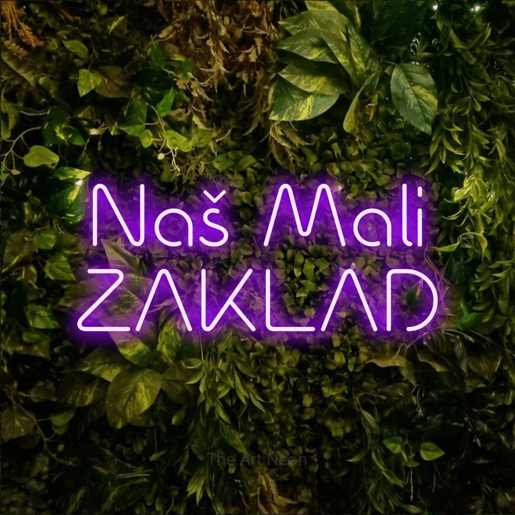 LED neon sign reading “Naš Mali ZAKLAD”, arranged in two lines.