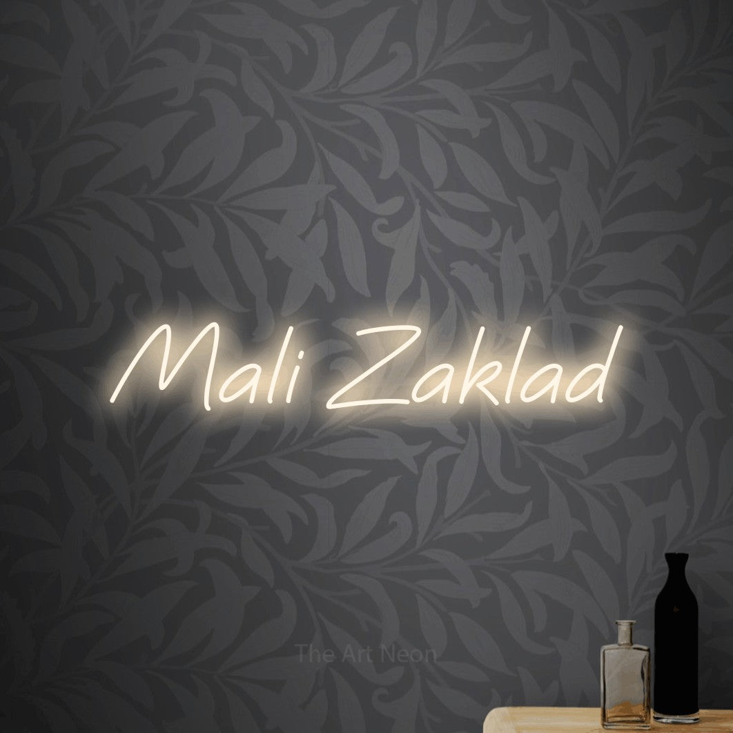 LED neon sign reading “Mali Zaklad”, arranged in a single line.
