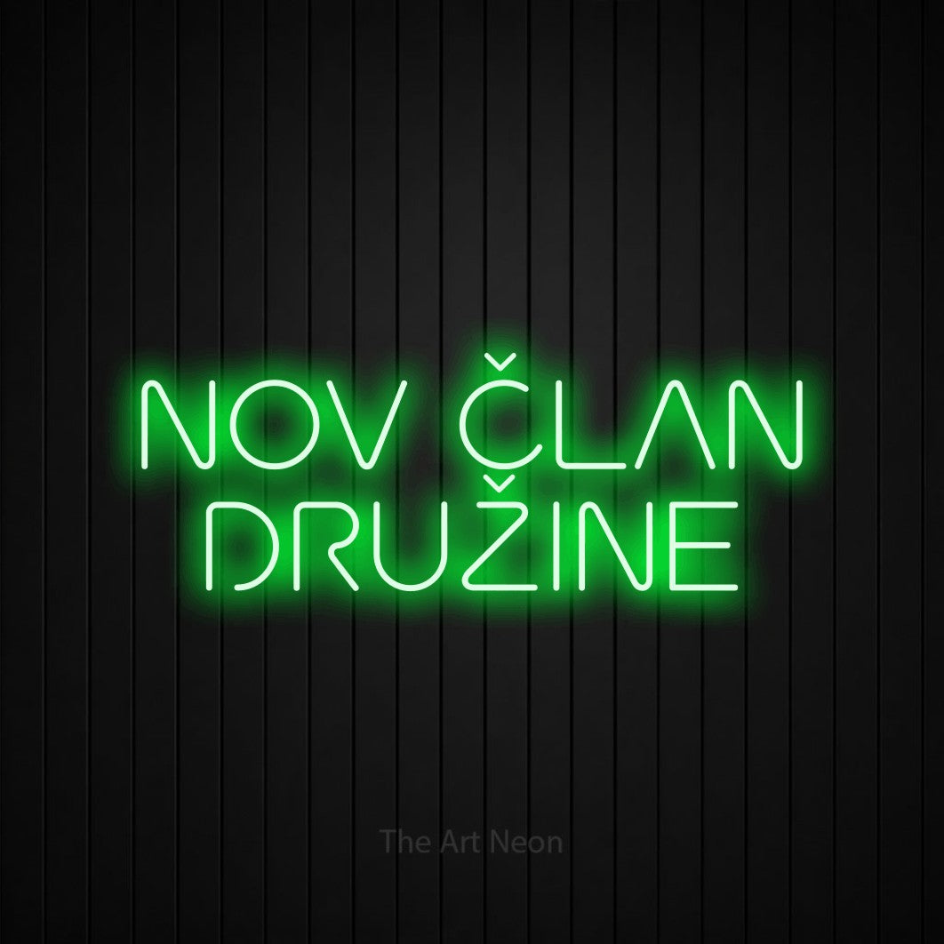 LED neon sign reading “NOV ČLAN DRUŽINE”, arranged in two lines.