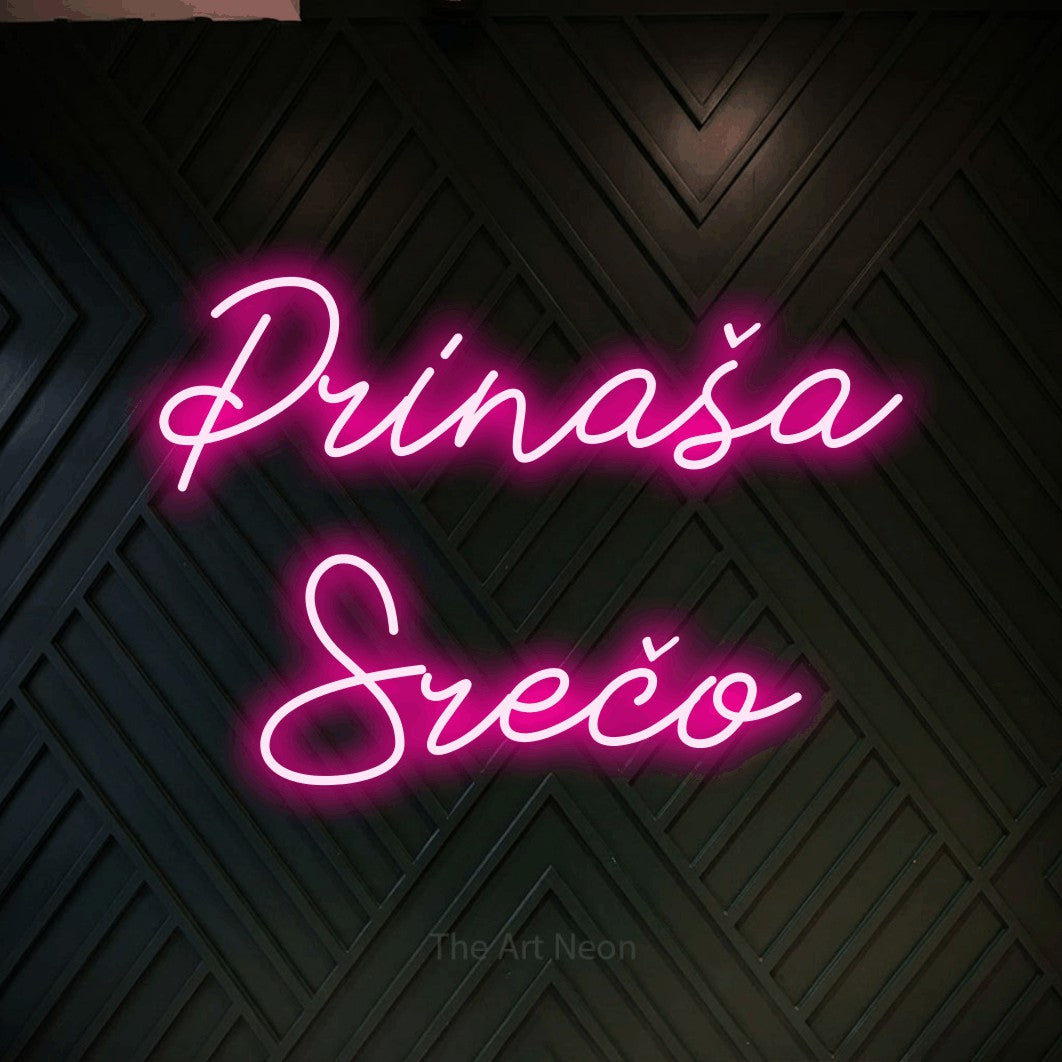 LED neon sign reading “Prinaša Srečo”, arranged in two lines.