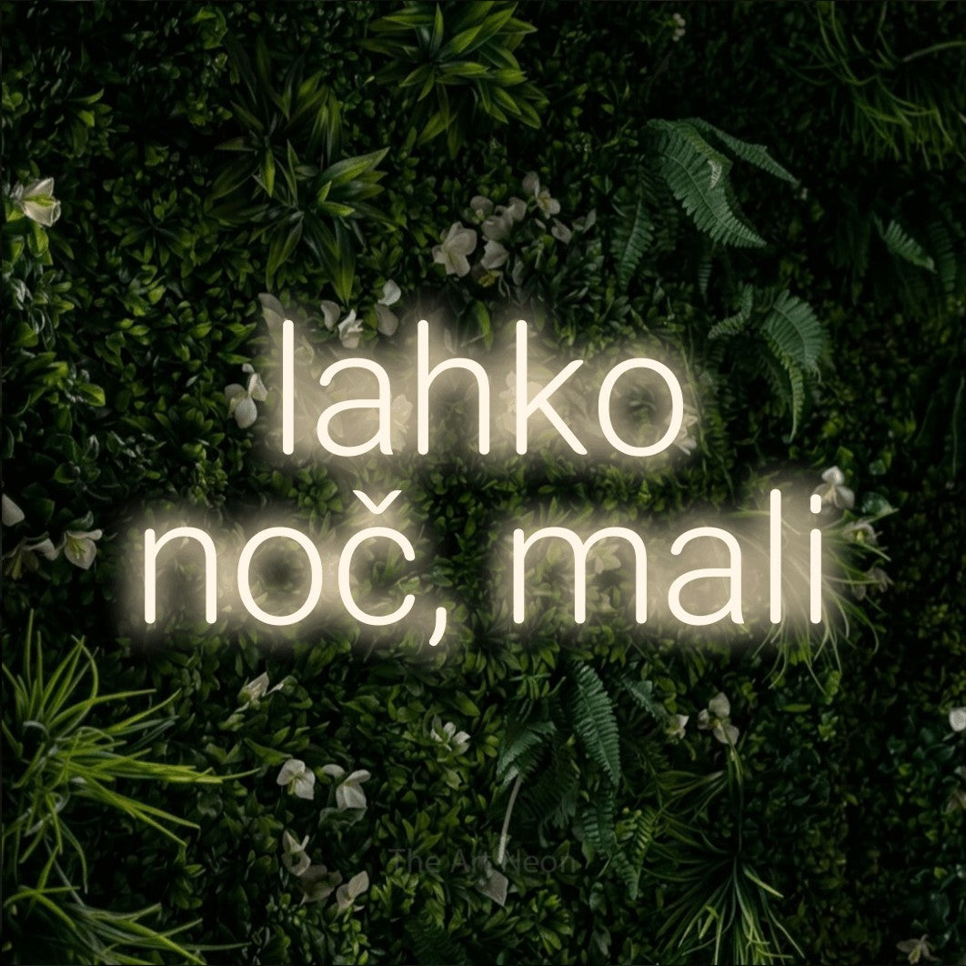 LED neon sign reading “lahko noč, mali”, arranged in two lines.