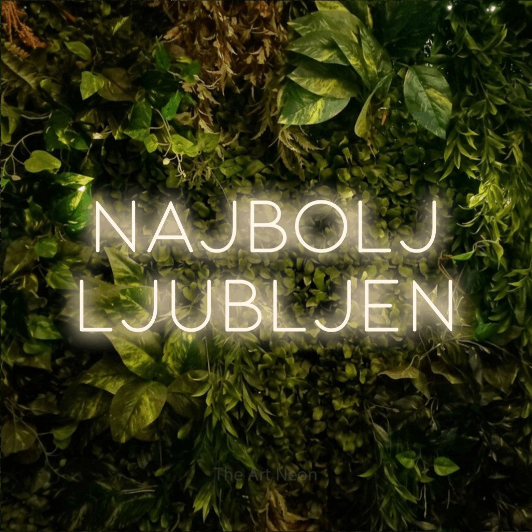 LED neon sign reading “Najbolj LJUBLJEN”, arranged in two lines.