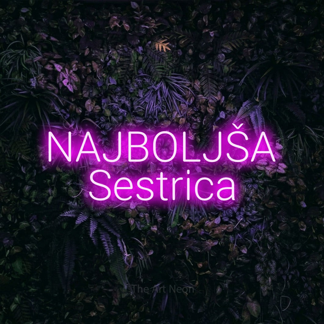 LED neon sign reading “NAJBOLJŠA Sestrica”, arranged in two lines.