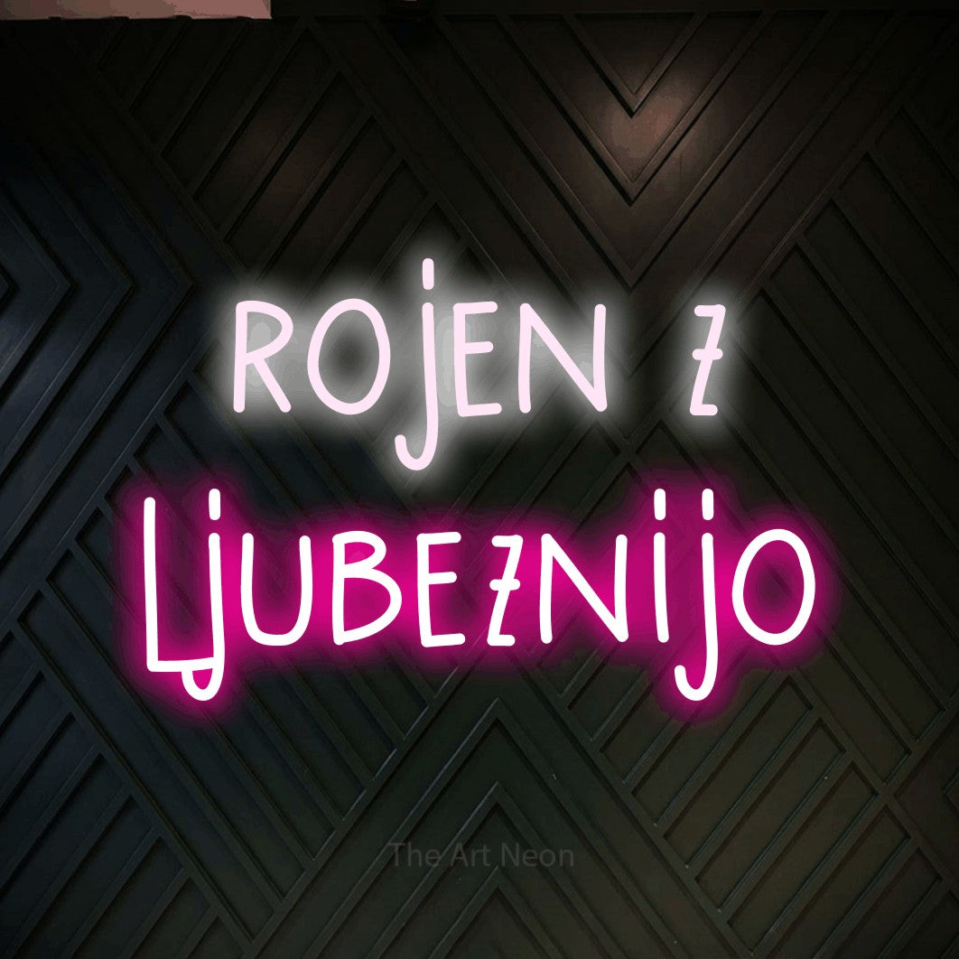 LED neon sign reading “rojen z ljubeznijo”, arranged in two lines.