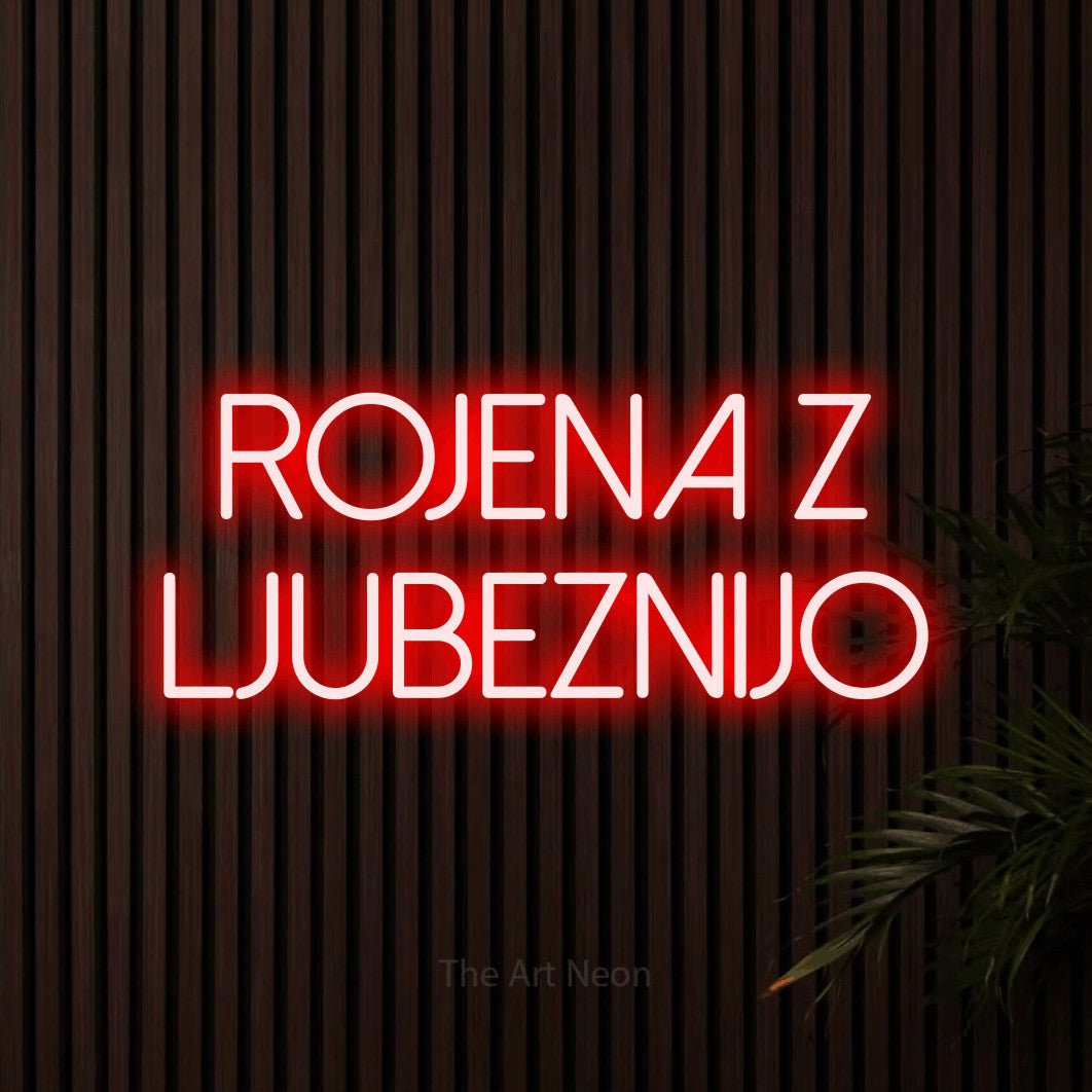 LED neon sign reading “Rojena z LJUBEZNIJO”, arranged in two lines.