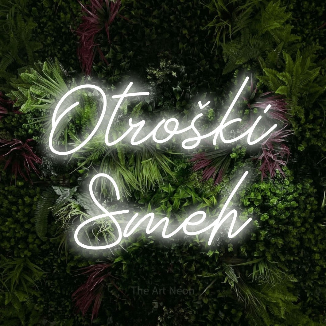 LED neon sign reading “Otroški Smeh”, arranged in two lines.