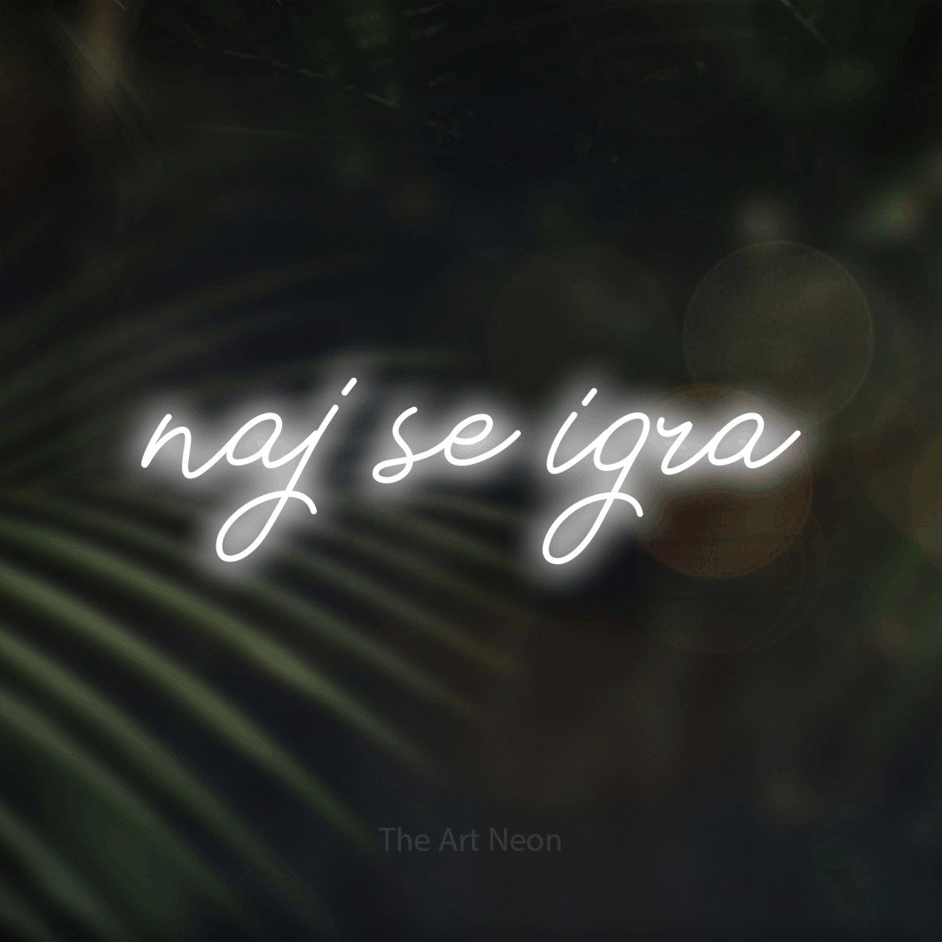 LED neon sign reading “naj se igra”, arranged in a single line.