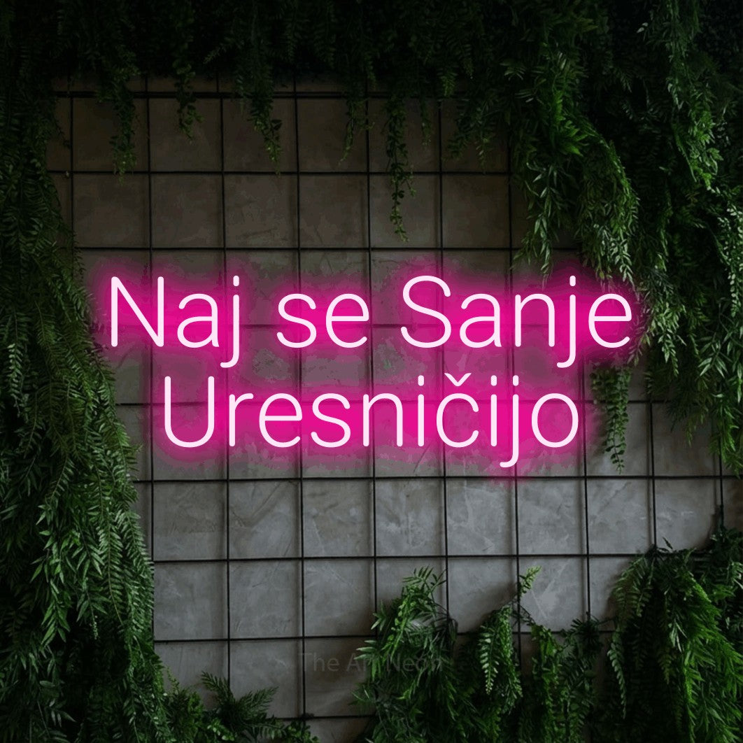 LED neon sign reading “Naj se Sanje Uresničijo”, arranged in two lines.