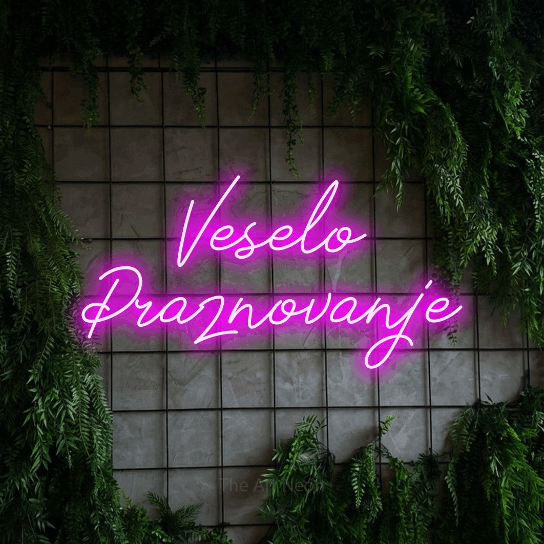 LED neon sign reading “Veselo Praznovanje”, arranged in two lines.