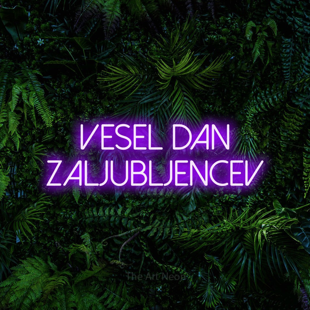 LED neon sign reading “vesel dan zaljubljencev”, arranged in two lines.