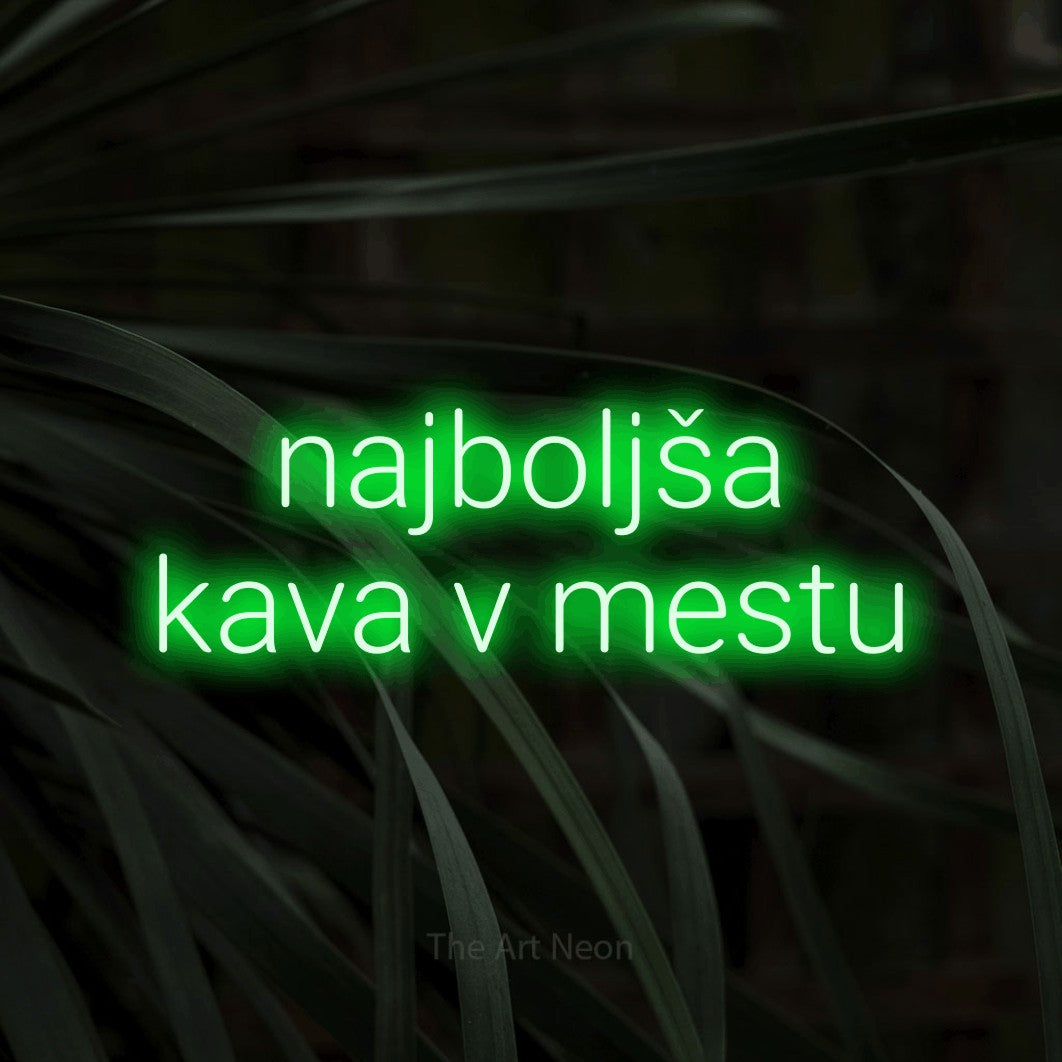 LED neon sign reading “najboljša kava v mestu”, arranged in two lines.