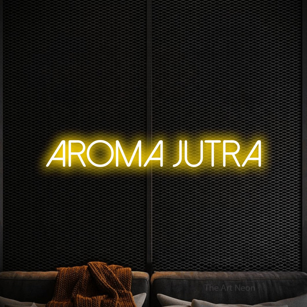 LED neon sign reading “AROMA Jutra”, arranged in a single line.