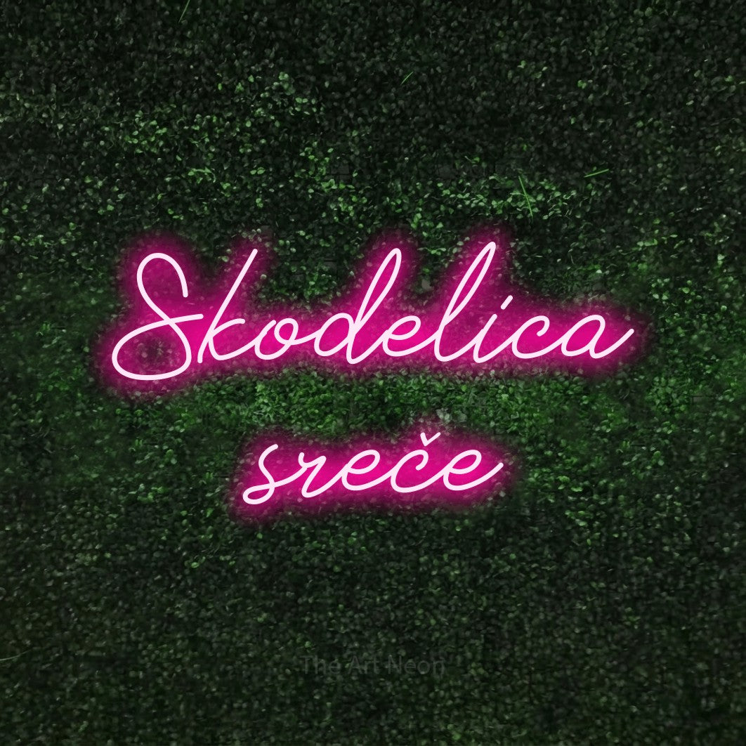 LED neon sign reading “Skodelica sreče”, arranged in two lines.