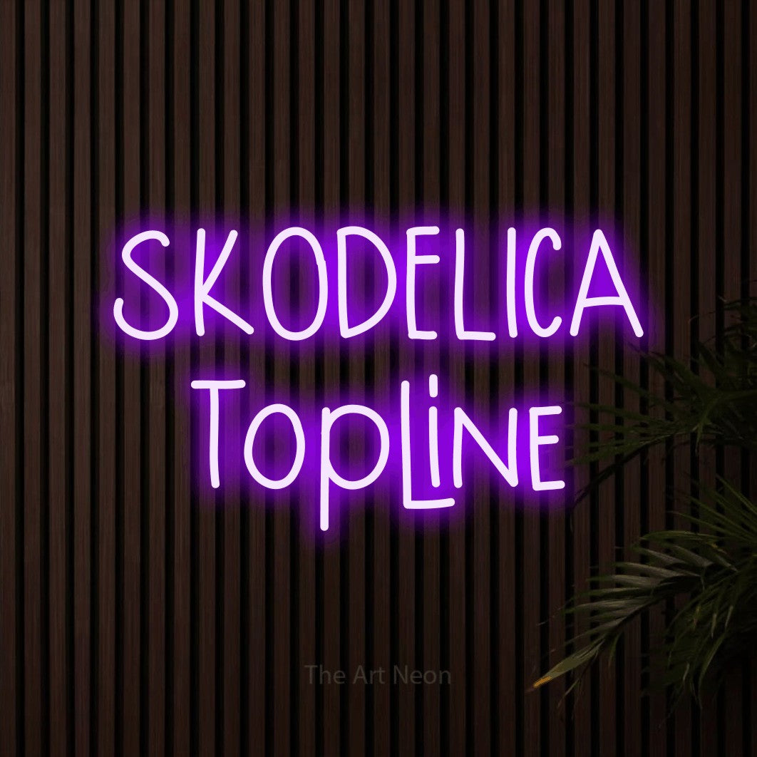 LED neon sign reading “SKODELICA Topline”, arranged in two lines.
