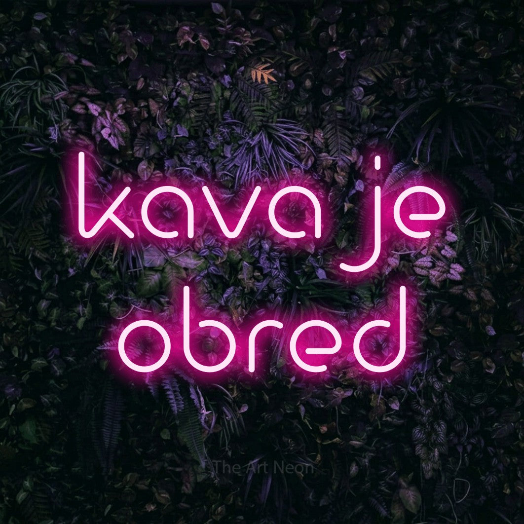 LED neon sign reading “kava je obred”, arranged in two lines.
