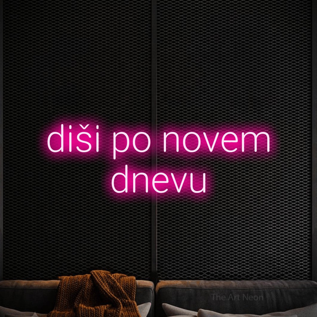 LED neon sign reading “diši po novem dnevu”, arranged in two lines.