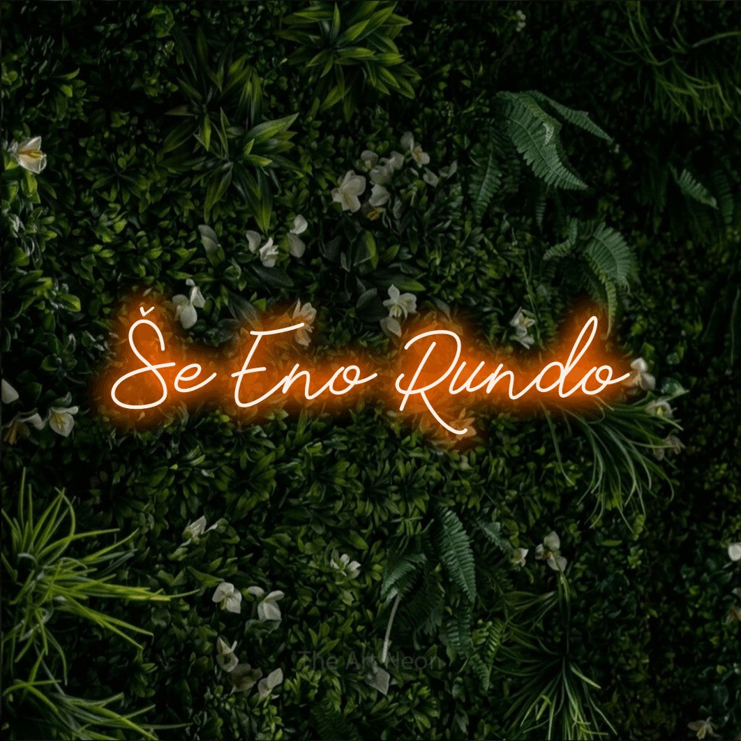 LED neon sign reading “Še Eno Rundo”, arranged in a single line.