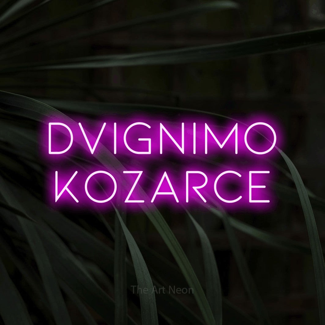 LED neon sign reading “DVIGNIMO KOZARCE”, arranged in two lines.