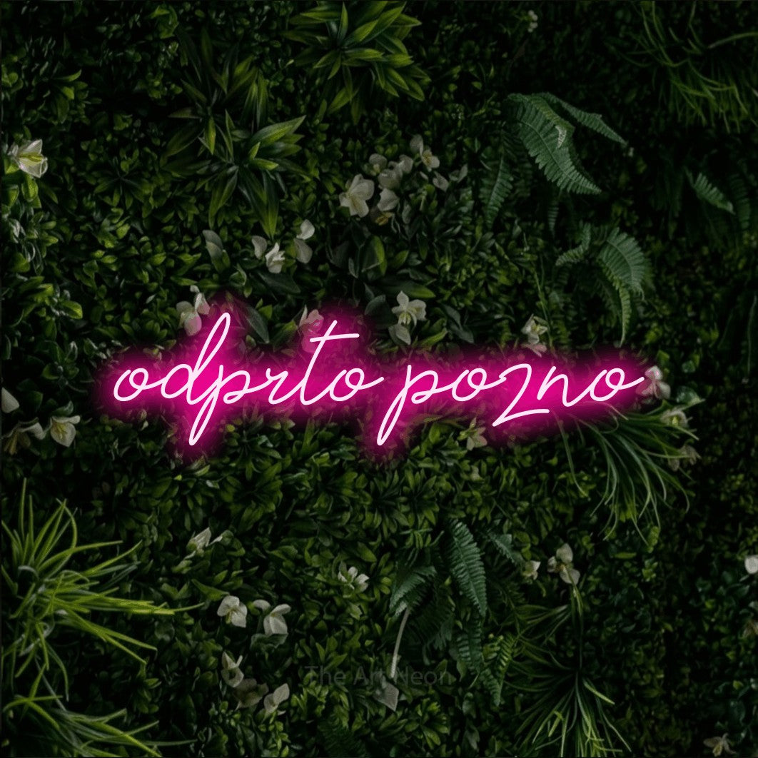 LED neon sign reading “odprto pozno”, arranged in a single line.