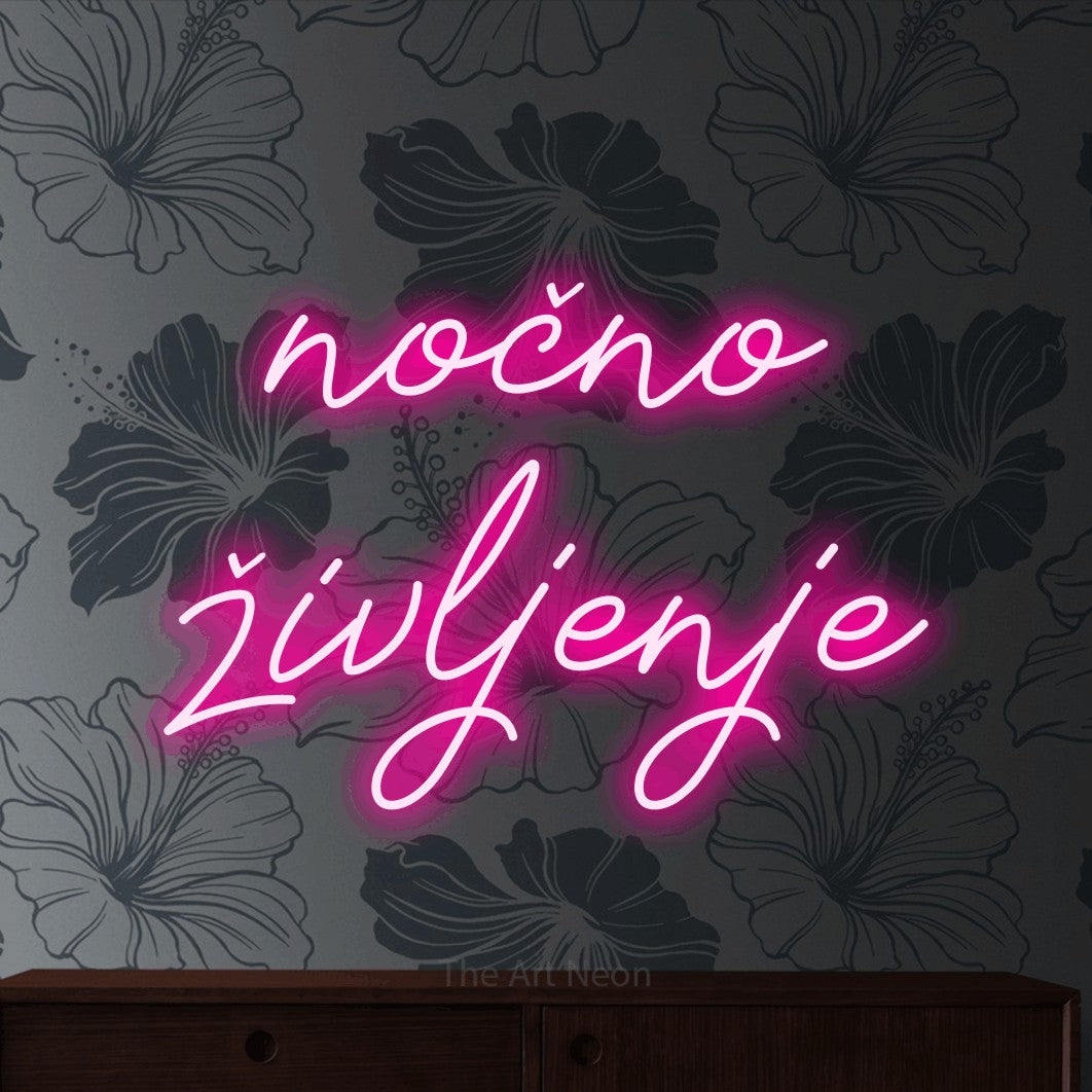 LED neon sign reading “nočno življenje”, arranged in two lines.