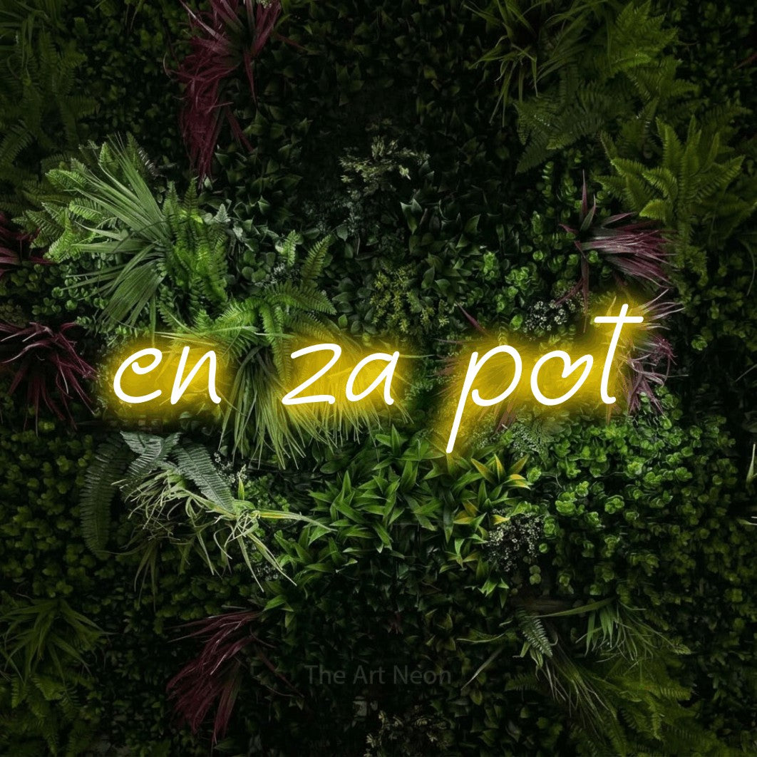 LED neon sign reading “en za pot”, arranged in a single line.