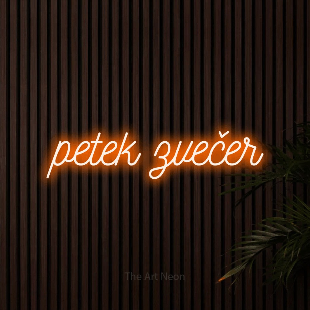 LED neon sign reading “petek zvečer”, arranged in a single line.