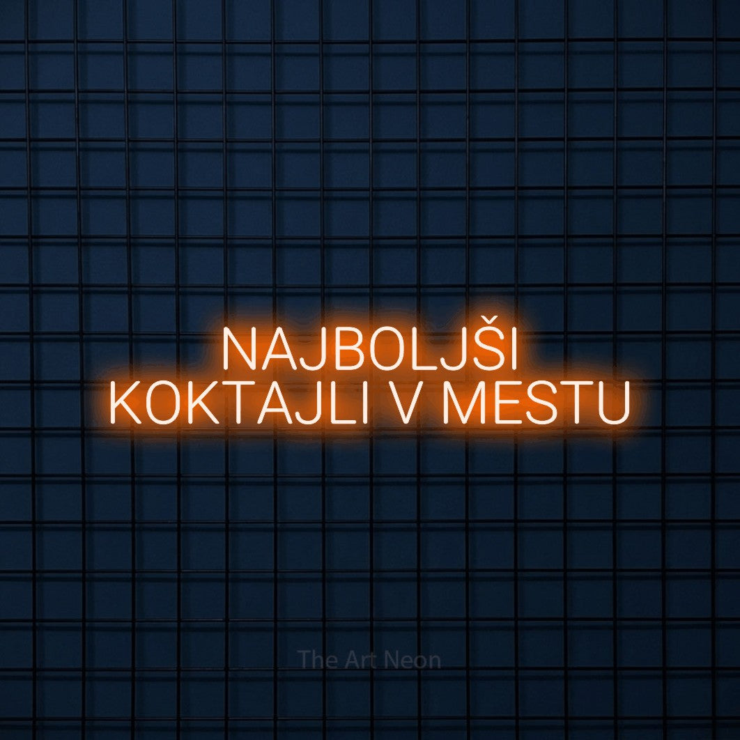 LED neon sign reading “NAJBOLJŠI KOKTAJLI V MESTU”, arranged in two lines.