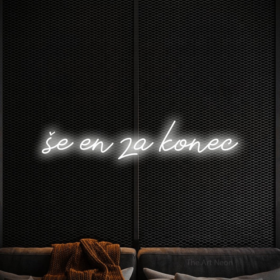 LED neon sign reading “še en za konec”, arranged in a single line.