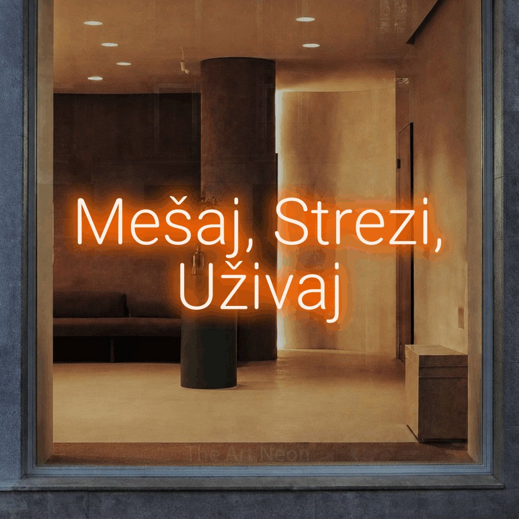LED neon sign reading “Mešaj, Strezi, Uživaj”, arranged in two lines.