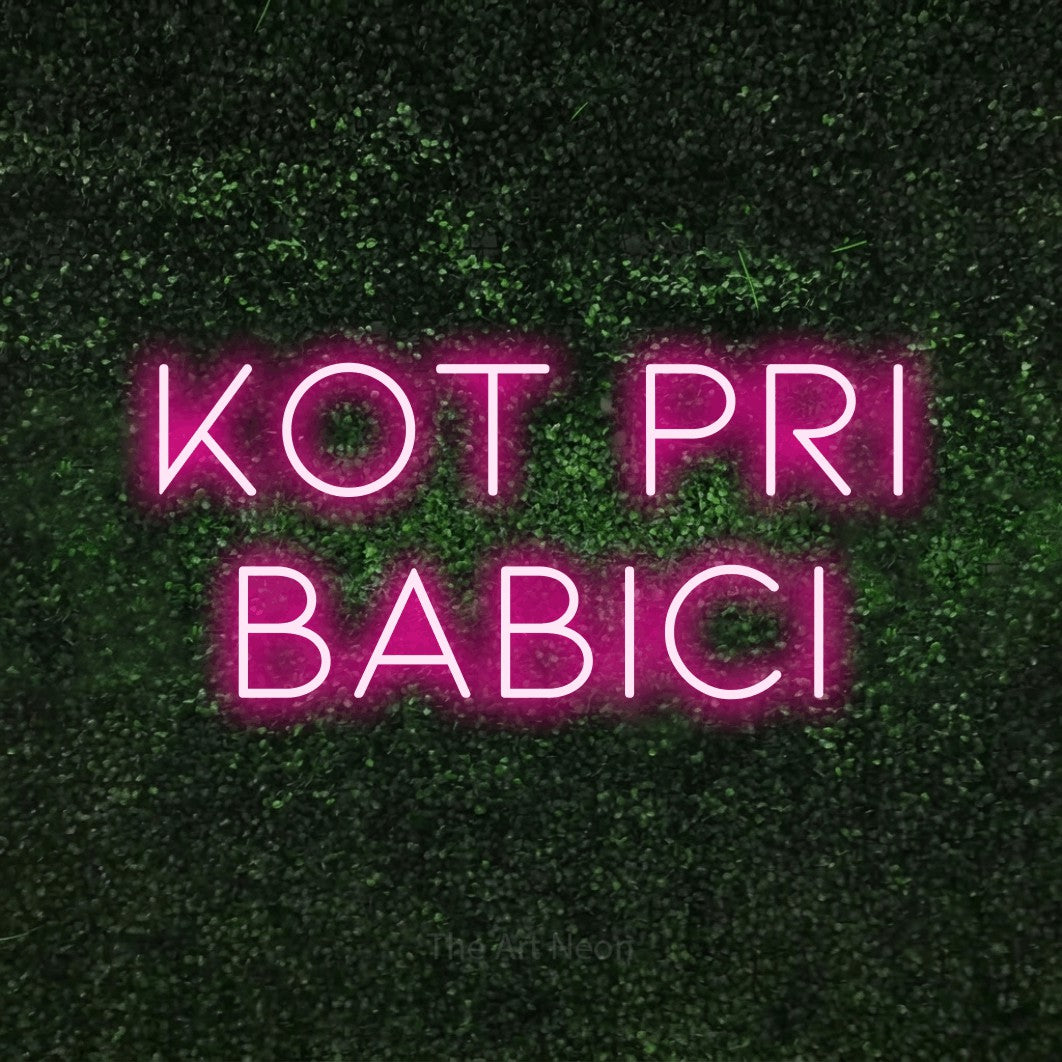 LED neon sign reading “Kot pri BABICI”, arranged in two lines.