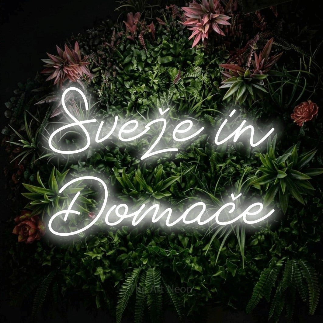 LED neon sign reading “Sveže in Domače”, arranged in two lines.