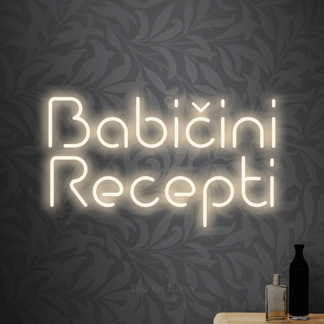 LED neon sign reading “Babičini Recepti”, arranged in two lines.