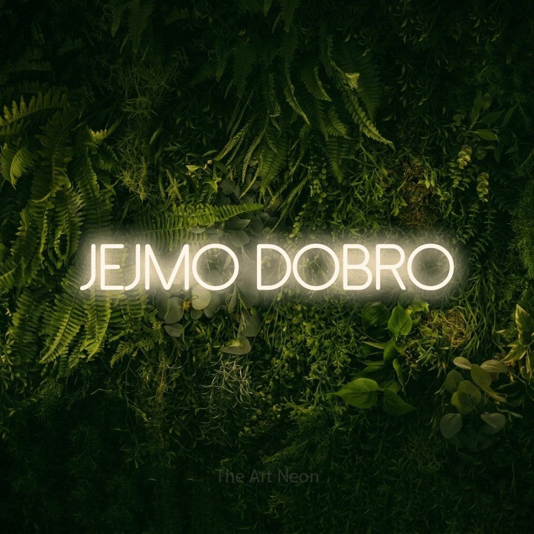 LED neon sign reading “jejmo dobro”, arranged in a single line.