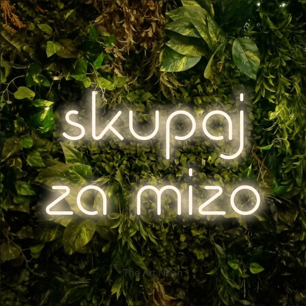 LED neon sign reading “skupaj za mizo”, arranged in two lines.