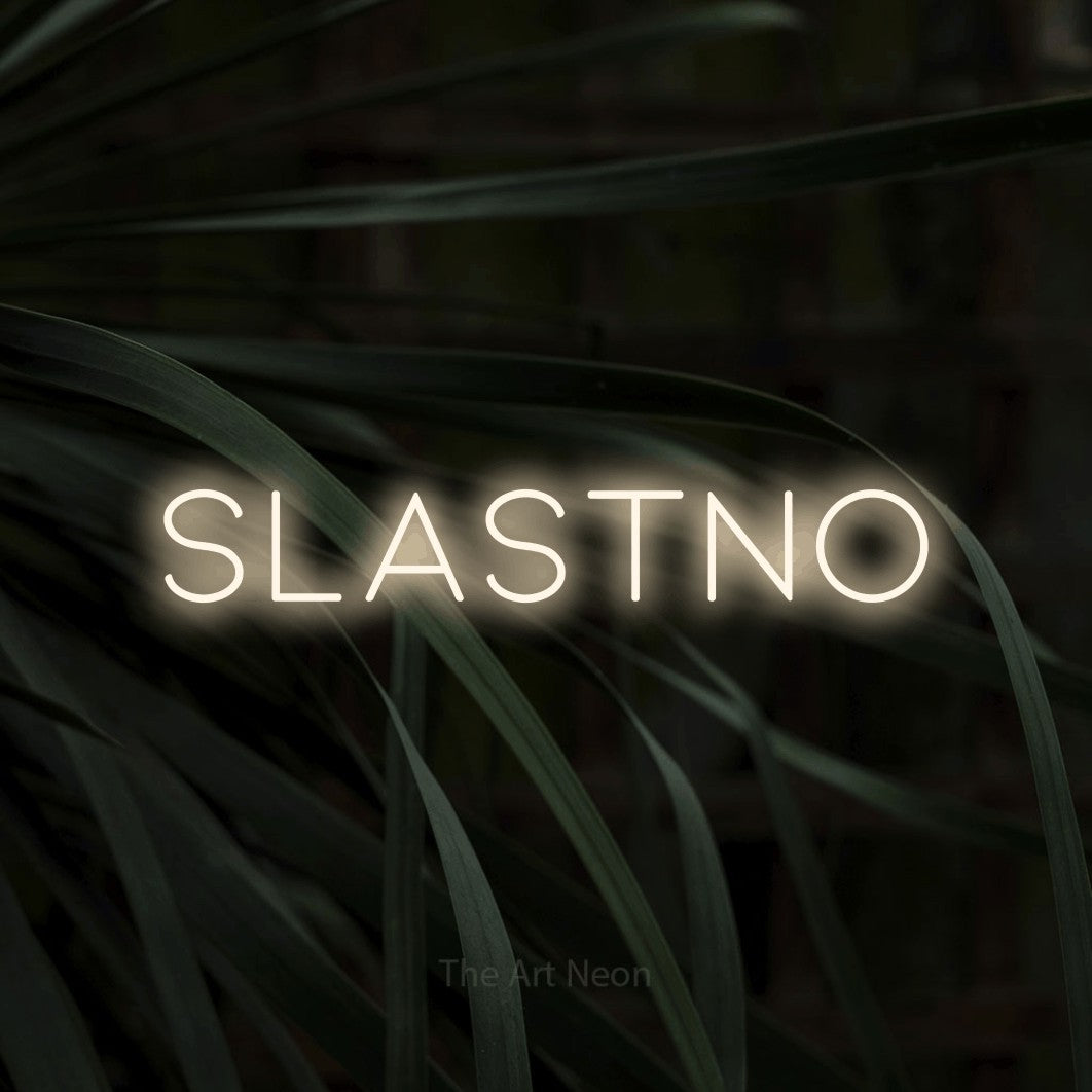 LED neon sign reading “SLASTNO”, arranged in a single line.