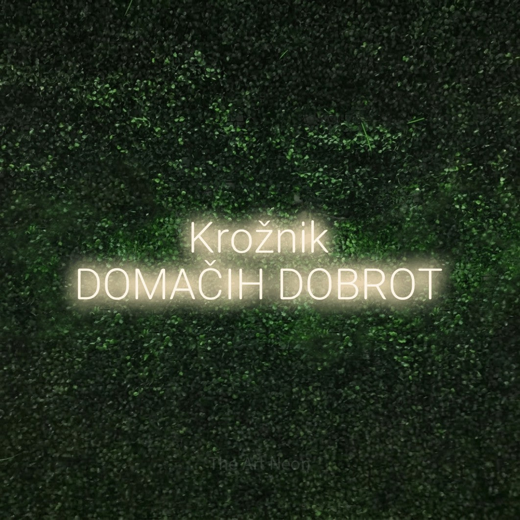 LED neon sign reading “Krožnik DOMAČIH DOBROT”, arranged in two lines.