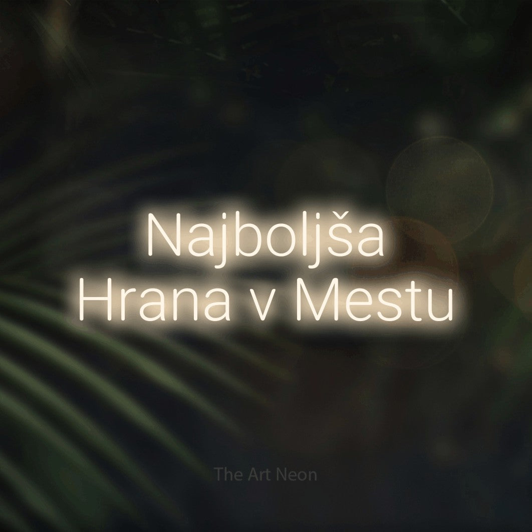 LED neon sign reading “Najboljša Hrana v Mestu”, arranged in two lines.